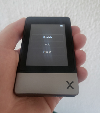 SecuX Neo X setup screen showing language selection options: English, Japanese, and Chinese.