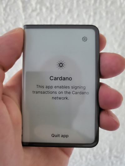 Ledger Stax hardware wallet displaying the installed Cardano (ADA) app on device screen.